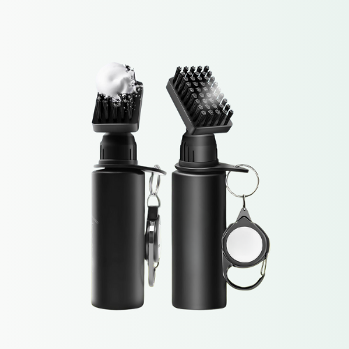 Black grooming tool with brush and mirror on a white background