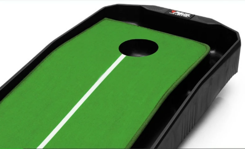 Green putting green with a black hole on a white background